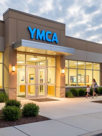 Exterior view of the YMCA in Fort Smith, Arkansas, with the entrance and welcoming facade under soft daylight.
